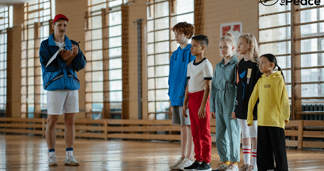 kids in gym clothes with a professor